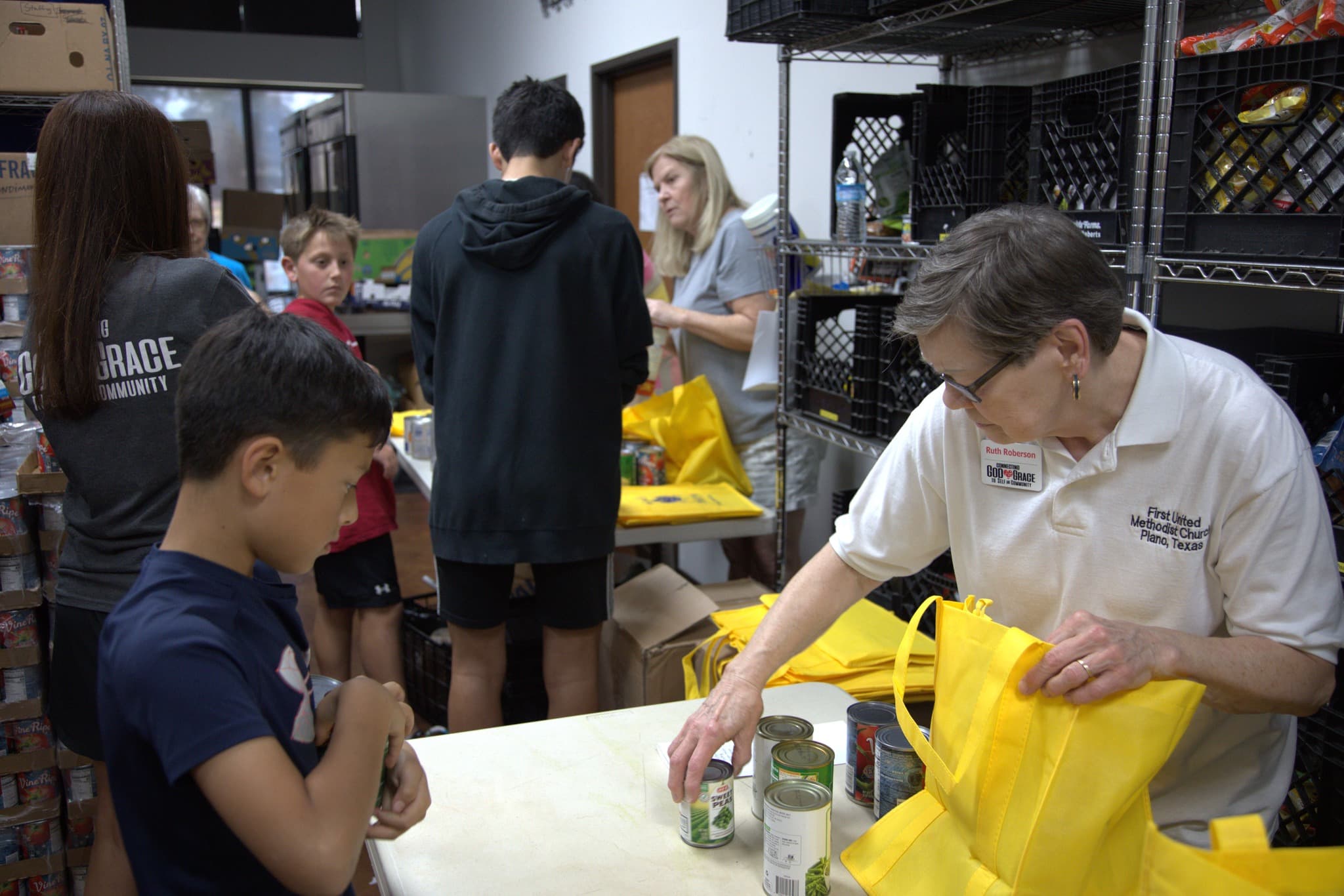 Volunteers sorting food at God's Pantry